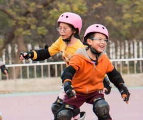 Children rollerblading Stock Photo