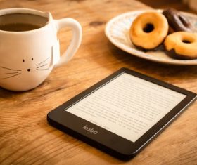 Coffee and donuts on the table Stock Photo