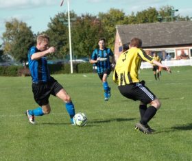 Fast-paced soccer game Stock Photo 01
