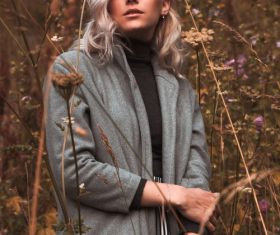 Female model taking photo shoot in autumn outdoors Stock Photo