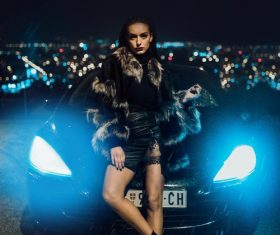 Girl and sports car under the night Stock Photo