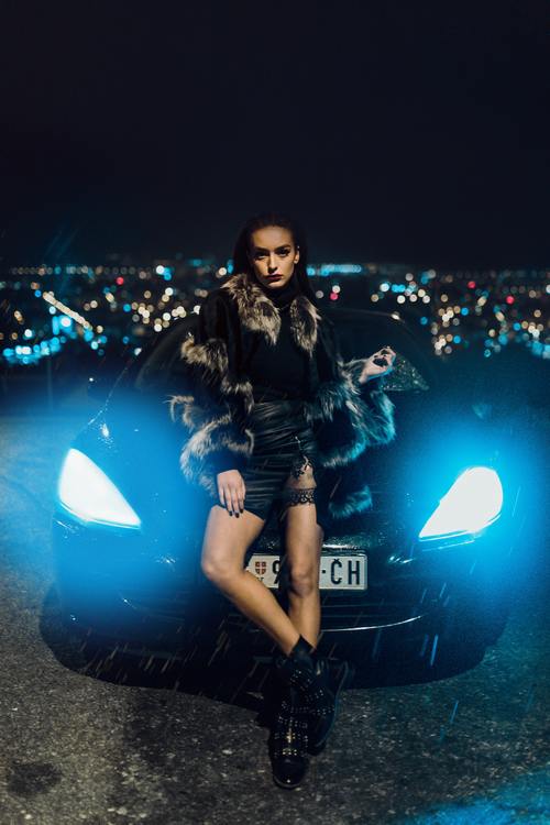 Girl and sports car under the night Stock Photo