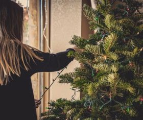 Girl decorating christmas tree Stock Photo 01