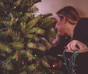 Girl decorating christmas tree Stock Photo 06