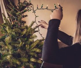 Girl decorating christmas tree Stock Photo 07