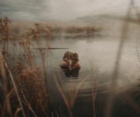 Intimate lovers in the water Stock Photo