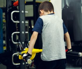 Little boy doing physical exercise Stock Photo