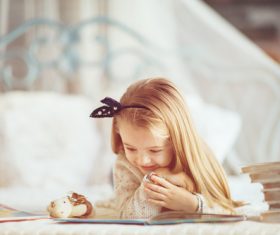 Little girl reading fairytale book Stock Photo