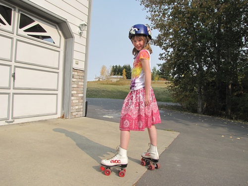 Little girl rollerblading Stock Photo