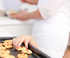 Little girl takes freshly baked cookies Stock Photo 03