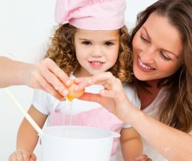 Mother and daughter making cookies together Stock Photo 01