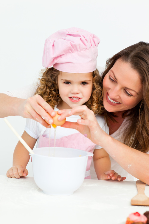 Mother and daughter making cookies together Stock Photo 01