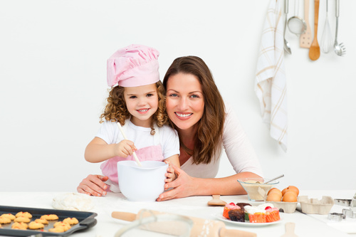Mother and daughter making cookies together Stock Photo 02