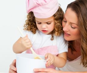 Mother and daughter making cookies together Stock Photo 03