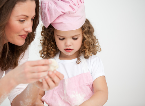 Mother and daughter making cookies together Stock Photo 08