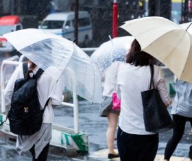 People with umbrellas on the rainy streets Stock Photo 03