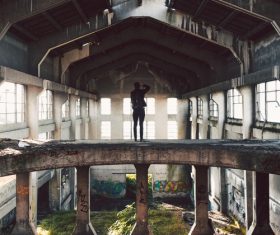 Photographer in abandoned house Stock Photo