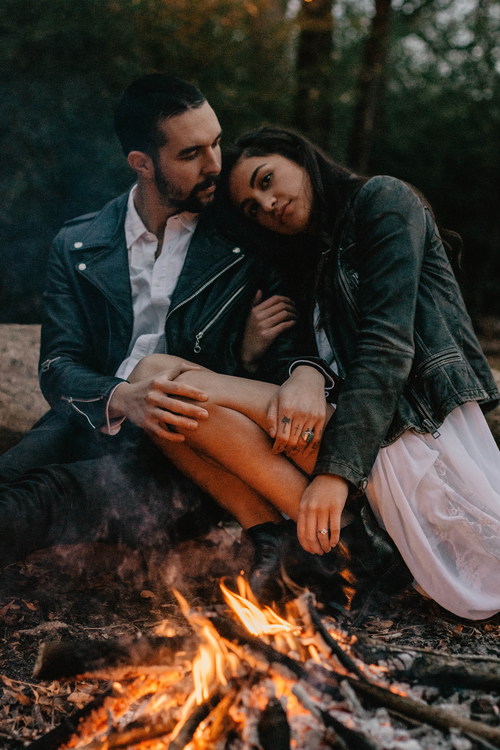 Romantic couple with campfire Stock Photo