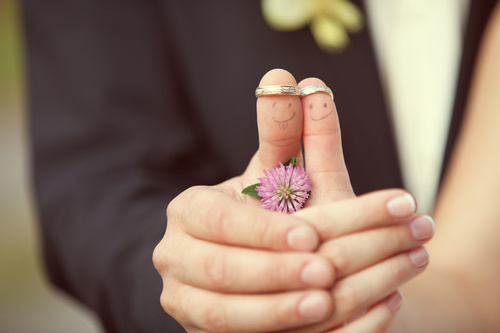 Romantic wedding ring on finger Stock Photo