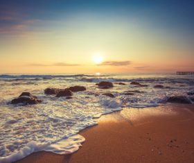 Sky sunshine and stones by the sea Stock Photo