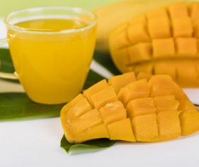 Sliced mango and freshly squeezed mango juice Stock Photo 02