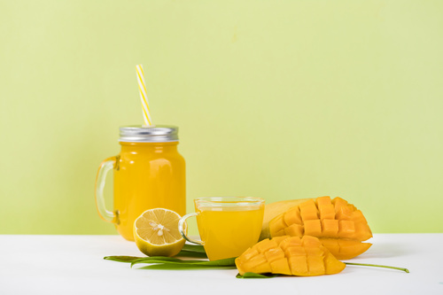 Sliced mango and freshly squeezed mango juice Stock Photo 03