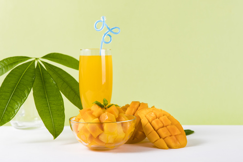 Sliced mango and freshly squeezed mango juice Stock Photo 05