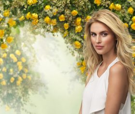 Smiling beautiful woman with different flowers background Stock Photo 01