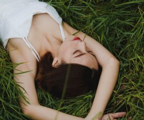 Stock Photo Girl lying on the grass