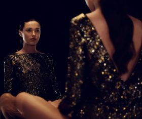 Stock Photo Girl sitting in front of the mirror