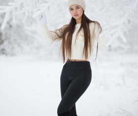 Stock Photo Girl taking pictures in the snow