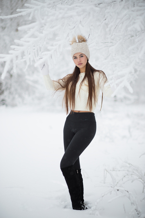 Stock Photo Girl taking pictures in the snow