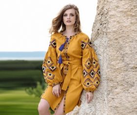 Stock Photo Girl taking pictures outdoors on the stone