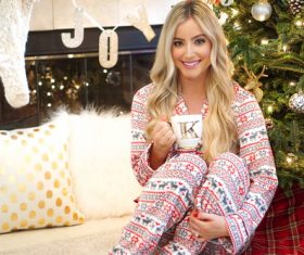 Stock Photo Girl wearing pajamas drinking coffee
