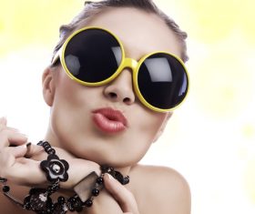 Stock Photo Girl with sunglasses pursed lips