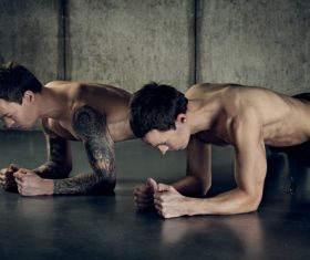 Stock Photo Twin brothers exercising together