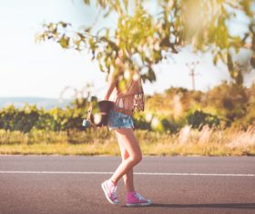 Summer Ride Longboard Girl Stock Photo