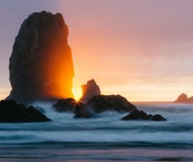 The rising sun at sea Stock Photo