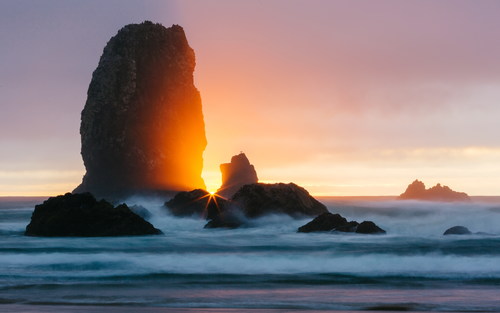 The rising sun at sea Stock Photo