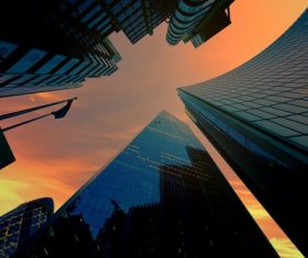 Wide angle lens of skyscraper under sunset Stock Photo