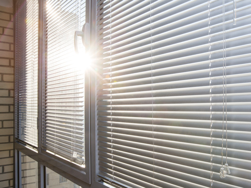 Window with sand coloured roll sun blinds Stock Photo 03