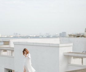 Woman walking on the roof Stock Photo