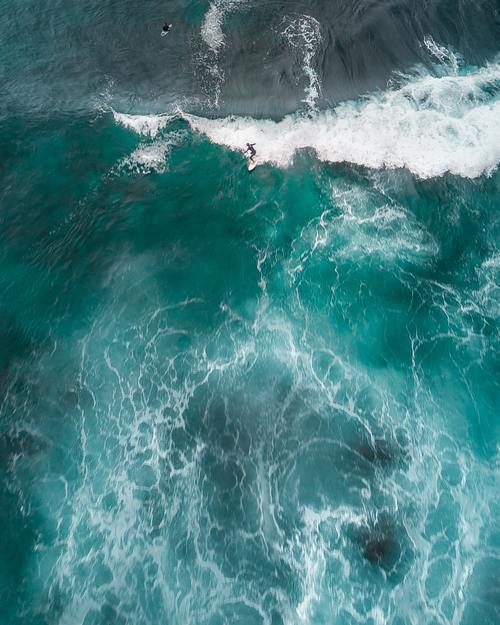 Aerial view of the waves rolling up on the sea Stock Photo