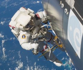 Astronaut walking maintenance in space Stock Photo 03