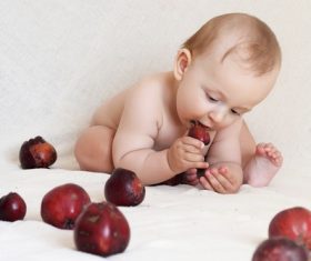 Baby eating food Stock Photo