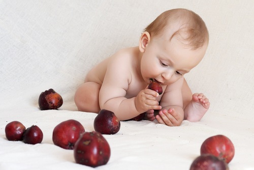 Baby eating food Stock Photo