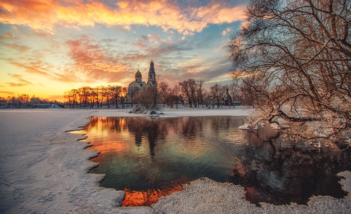 Beautiful winter landscape of sunset village Stock Photo