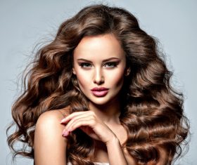 Beautiful woman with long brown curly hair Stock Photo 02