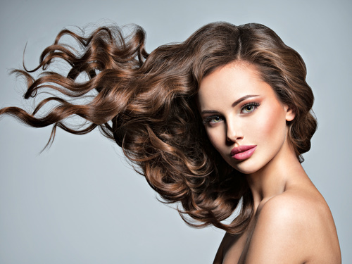 Beautiful woman with long brown curly hair Stock Photo 06
