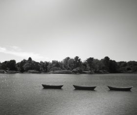 Black and white photo Canoes Floating on Lake Stock Photo